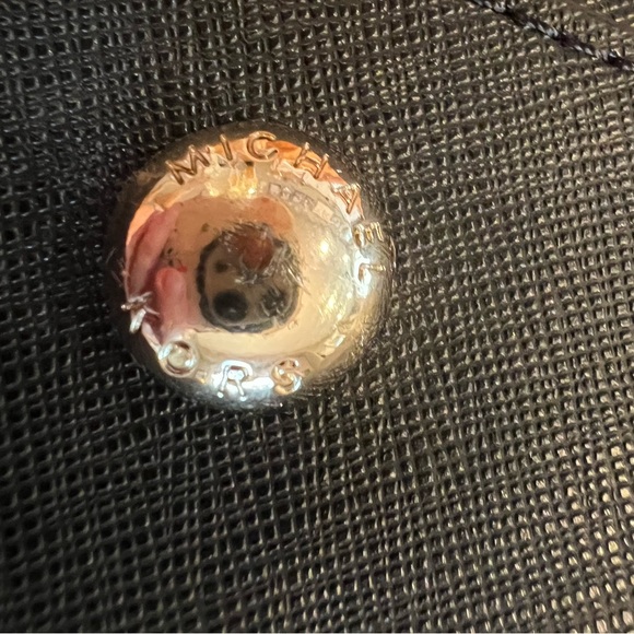 Black hard leather Michael kors handbag. 14 inches wide by 10 inches tall. - Picture 6 of 7